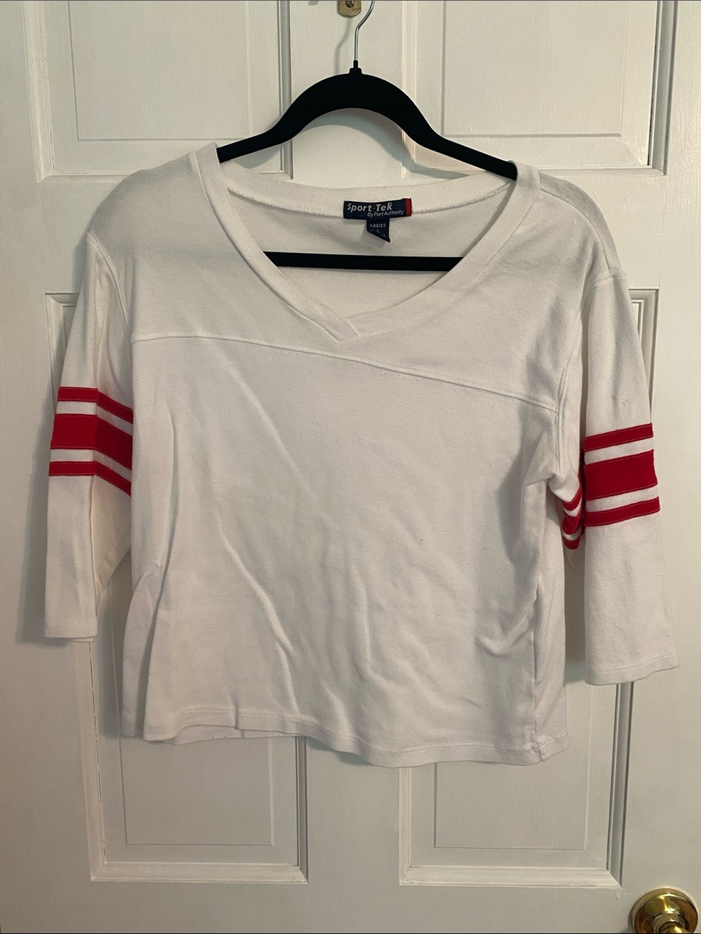 Sport-Tek White V-Neck Short Sleeve Tee with Red Sleeve Stripes